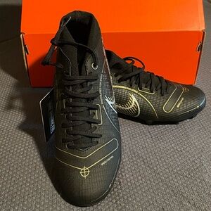 NWT box included. Nike Superfly 8 cleats. Black with gold & silver accent.